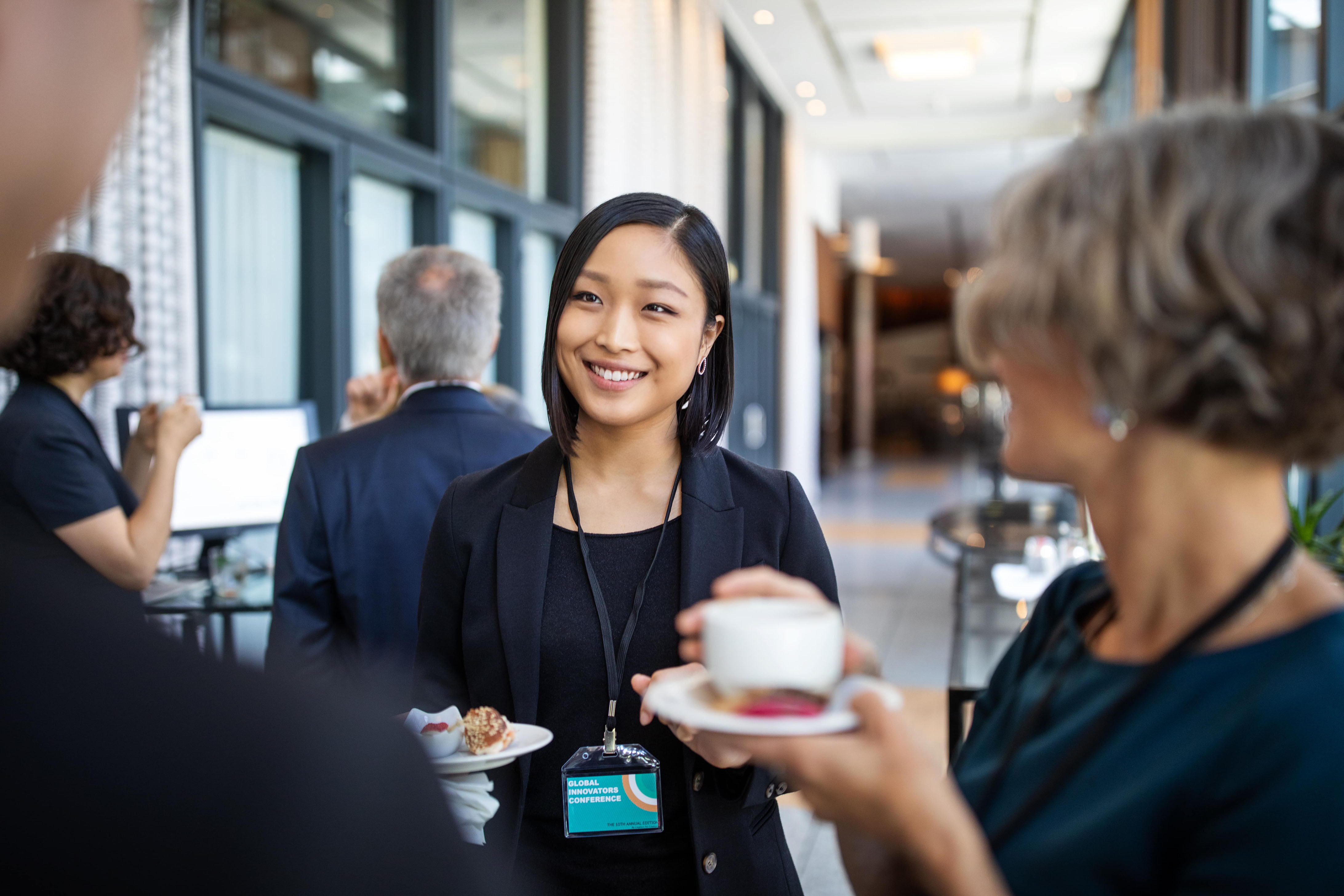 Woman speaking with others at event