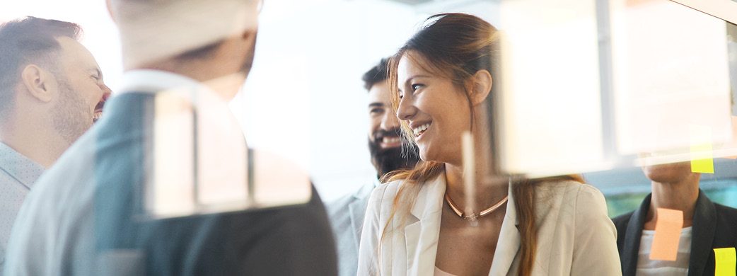 Coworkers brainstorming with sticky notes