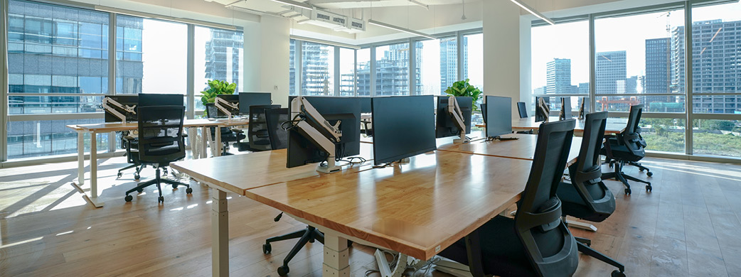 empty office of desks and chairs