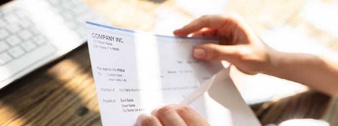 person opening paycheck